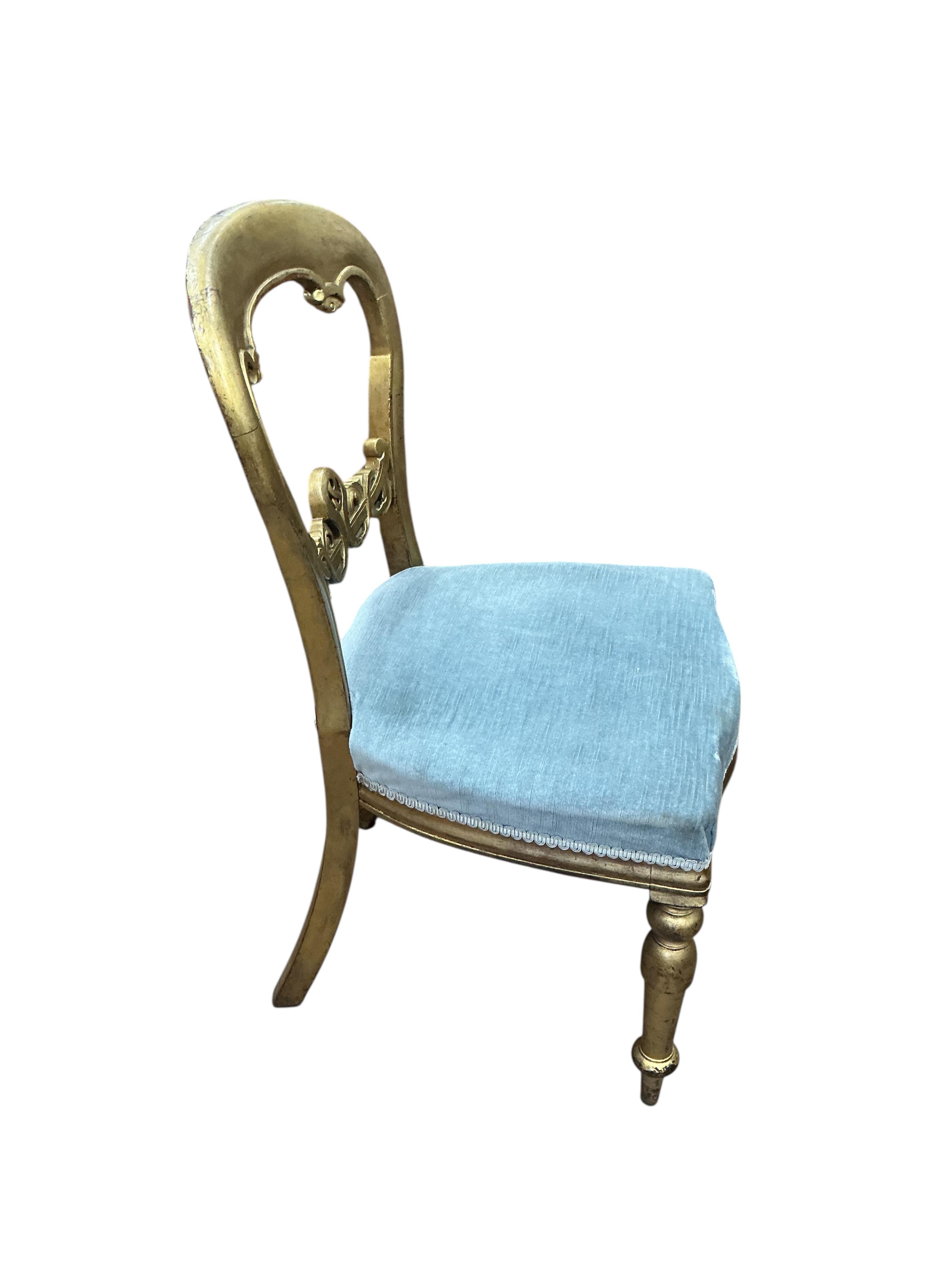 A William IV and later segmental mahogany veneer, parcel gilt circular tilt top breakfast table, diameter 120cm, height 72cm and a harlequin set of six later painted balloon back chairs